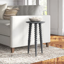 Ozzy distressed grey wood end table with bobbin turned legs styled next to a couch