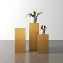 Karson brushed gold pedestal nesting tables styled with potted plants