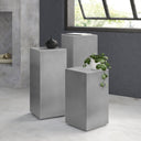 Karson brushed metal pedestal nesting tables styled in a modern room