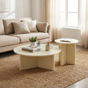 Aidan Cross Legs End Table pair styled in a bright living room, featuring round tops and fluted cross-leg bases.