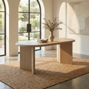 Byron Oval 6 Seater Dining Table in black finish styled with upholstered dining chairs in an elegant dark-toned dining room.