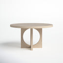 Front view of the Loyal Round 6 Seater Dining Table highlighting its round wooden tabletop and sculptural geometric pedestal with circular opening.