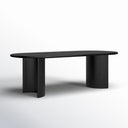 Kiaan Oval 6 Seater Dining Table in black finish shown against a white background, featuring a smooth oval tabletop and curved pedestal legs.