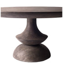 Close-up of the Musa Dining Table pedestal showing the curved central column, rounded middle section and natural wood detailing