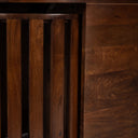 Close up front view of Douglas nesting table showing solid wood panel grain and slatted stool details