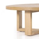 Close up profile view of Blaise coffee table thick wooden legs and square base frame