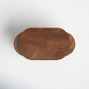 Top down view of Douglas solid wood nesting table set showing oval tabletop grain