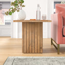 Aron square solid wood end table with fluted pedestal base styled in a room