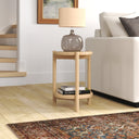 Jerry round natural wood end table with two tiers and cylindrical legs styled in a living room