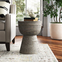 Jerry grey textured solid wood hourglass sculptural end table styled in a room