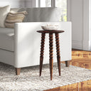 Ozzy round solid mango wood end table with bobbin turned legs styled next to a couch