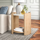 Casen round marble top end table with curved light wood panel legs styled in a room