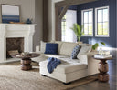 Tommy dark brown solid wood coffee table and end table set styled in a living room