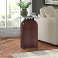 Trace round marble top side table with arched mahogany wood pedestal base styled in a room