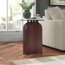Trace round marble top side table with arched mahogany wood pedestal base styled in a room
