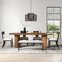 Kiaan Oval 6 Seater Dining Table in natural wood finish displayed in a contemporary dining room with a neutral rug, large windows, and decorative centerpiece.