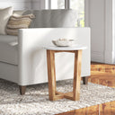Forest round marble top end table with geometric wooden X-base legs styled in a room