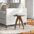 Titan round solid wood 3 legs end table with arched tripod base styled in a room