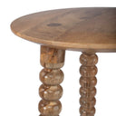 Macro view of Ozzy table top edge showing light mango wood grain and bobbin turned leg joint
