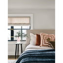Ozzy black dark espresso wood end table styled as a nightstand next to a bed