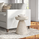 Drum Wooden Accent Table - Briar cylindrical side table with a round top and distressed white finish beside a sofa.