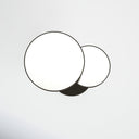 Modern End Table - Maximo round pedestal side table viewed from above, showing its two circular tabletops and black metal base.