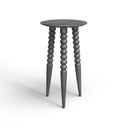 Ozzy grey textured solid wood tripod end table side studio view showcasing bobbin beaded legs