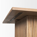 Underneath view of Davian coffee table showing metal support brackets and fluted base assembly