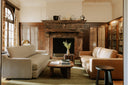 Keaton dark brown fluted block end table styled in a historic living room with marble fireplace