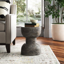 Salem grey textured solid wood hourglass sculptural end table styled in a room