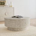 Khari round white coffee table featuring a textured cylindrical wood block drum design