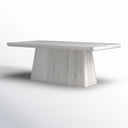 Angled view of the whitewashed Langston Dining Table highlighting its substantial pedestal base and softly rounded tabletop edges.