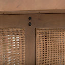 Close up hardware view of Lachlan dark wood coffee table base assembly screws and cane webbing