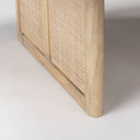 Close up detail of woven cane panel inserts on Lachlan coffee table solid wood leg frame