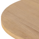 Detailed zoom view of smooth curved tabletop corner on Blaise solid wood furniture