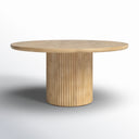 Mylo Round 6 Seater Dining Table featuring a smooth circular tabletop and sculptural rounded pedestal base, photographed against a white background.