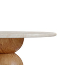 Close-up of the Vincenzo Outdoor Dining Table showing the smooth rounded edge of its cream stone-look tabletop and natural wood pedestal.