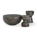 Three different grey textured solid wood coffee and accent tables shown together in a studio view