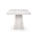 Straight-on view of the whitewashed Langston Dining Table emphasizing the clean lines of its tabletop and sculptural pedestal base.