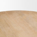 Close-up of the Mylo Dining Table tabletop showcasing the light natural wood grain and gently curved edge.