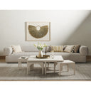 Remi whitewashed wood nesting coffee table set with smaller tables pulled out in a bright living room