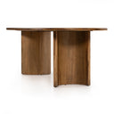 Close-up of the natural wood Kiaan dining table showing the smooth tabletop surface and rounded edge with visible wood grain.