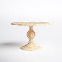 Hugh Round Dining Table shown against a white background, highlighting its circular wooden top, sculpted central pedestal, and broad tiered base.