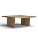 Lachlan square light wood coffee table three-quarter studio angle showcasing woven rattan legs
