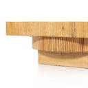 Close up detail of Harry coffee table thick tabletop edge and ribbed cylindrical base tier