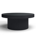 Bridger round black wood coffee table three-quarter studio view showcasing ribbed drum pedestal base