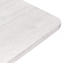 Close-up of the whitewashed Langston Dining Table showing the textured wood grain and rounded tabletop corner.