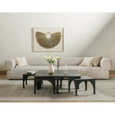 Remi charcoal black wood nesting coffee table set with smaller tables pulled out in a bright living room