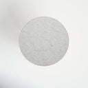 Top down view of Forest round end table showing white marble surface layout with grey veining