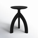 Cillian round black solid wood end table straight front studio view showcasing arched base